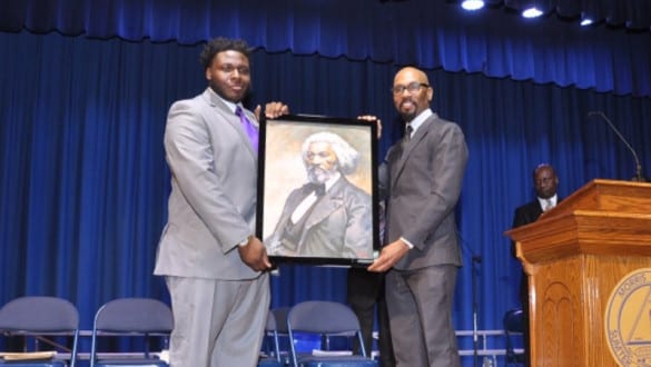 Alan Philip-Eon Johnson III receiving award