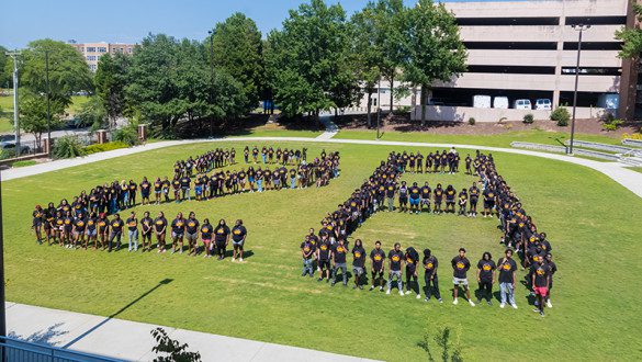 Group of students standing in a "28" formation