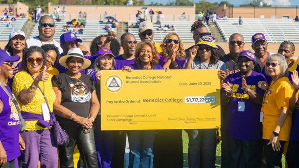 A group representing Benedict College holding a large check from the 2025 Annual Fundraiser.