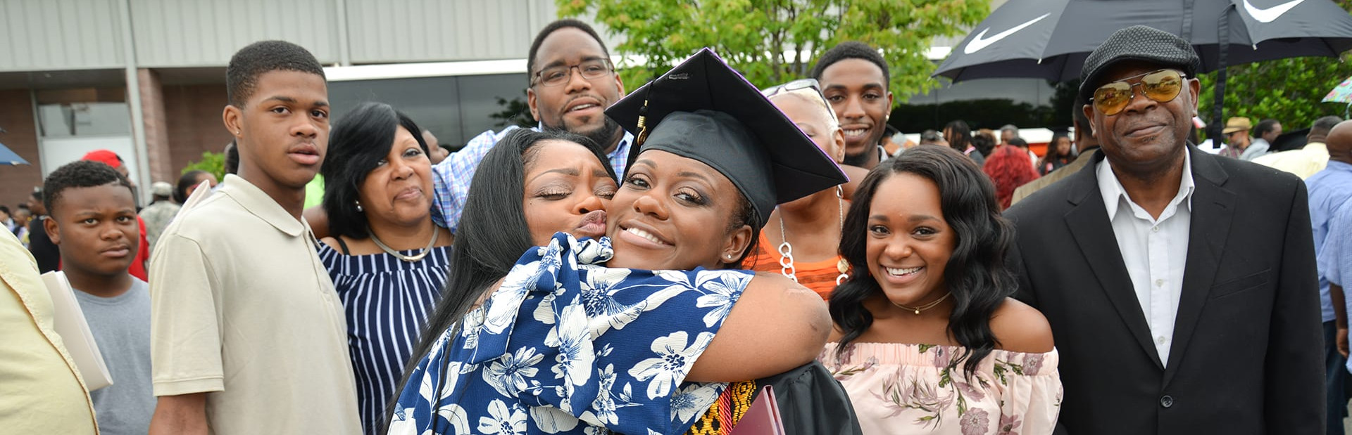 Group photo of family outside at graduation
