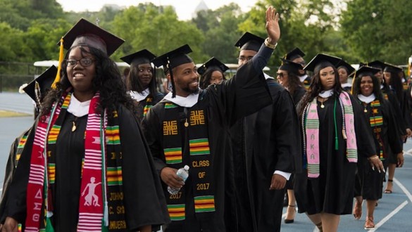 Johnson C Smith graduates lined up for graduation ceremony wearing caps and gowns