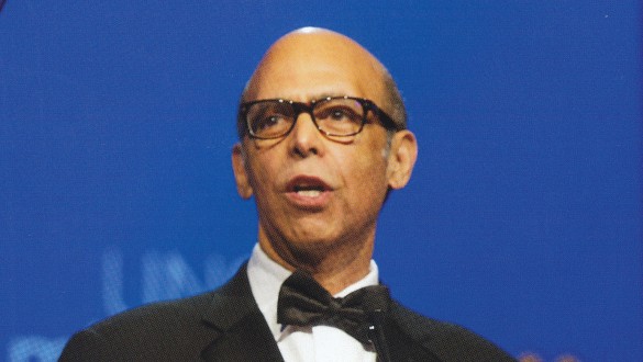 Headshot of Michael Lomax speaking