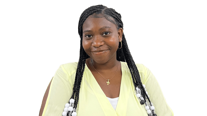 Melissa Allaro wearing a light yellow shirt and a gold cross necklace in front of a transparent background.
