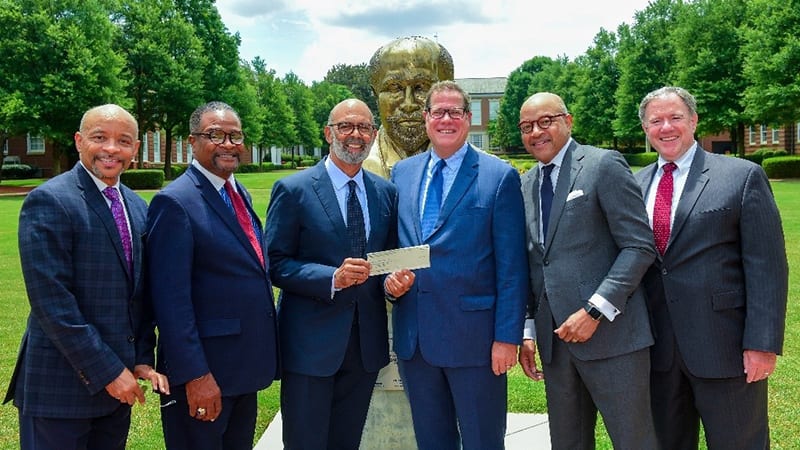 A group of men in suits standing together