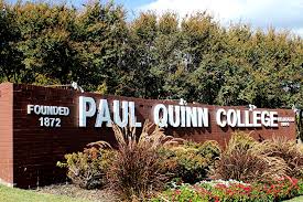 A brick wall that reads "Founded 1872, Paul Quinn College"