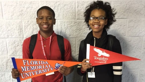 boy and girl with school banners