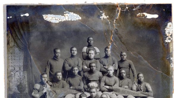 historic black and white photo of Wilberforce University's football team, the image is damaged