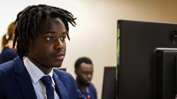 Bethune-Cookman student looking at a computer monitor