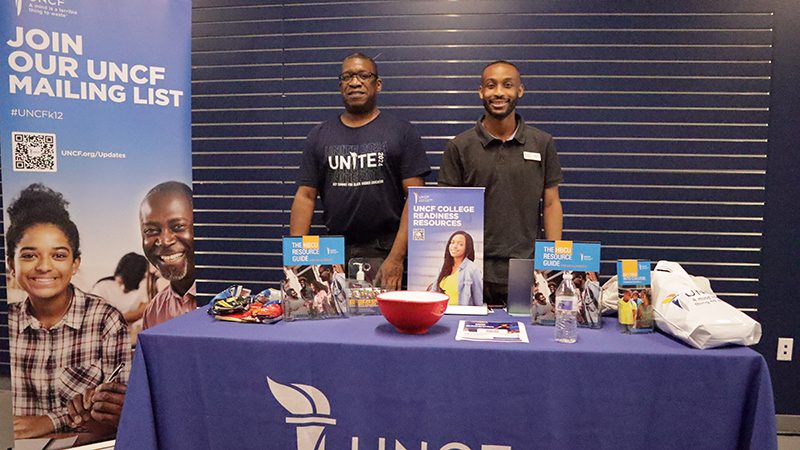 Two people standing at a table