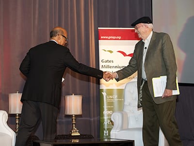 Bill Gates Gates senior and Michael Lomax shaking hands