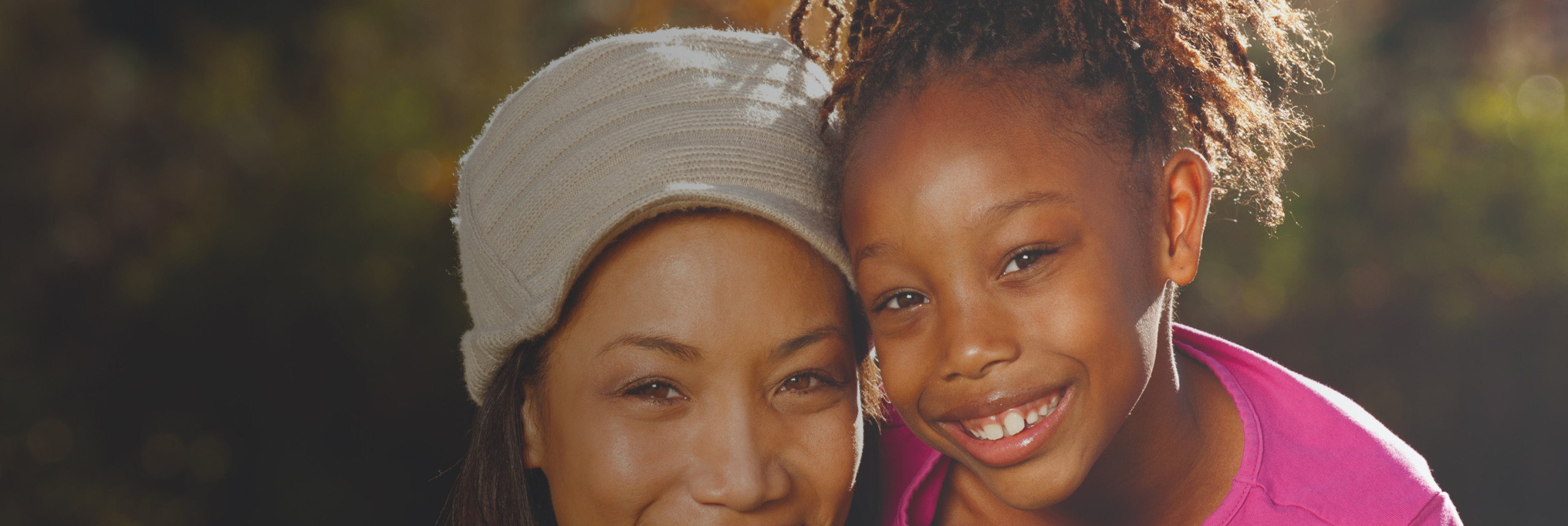 Mother and daughter smiling