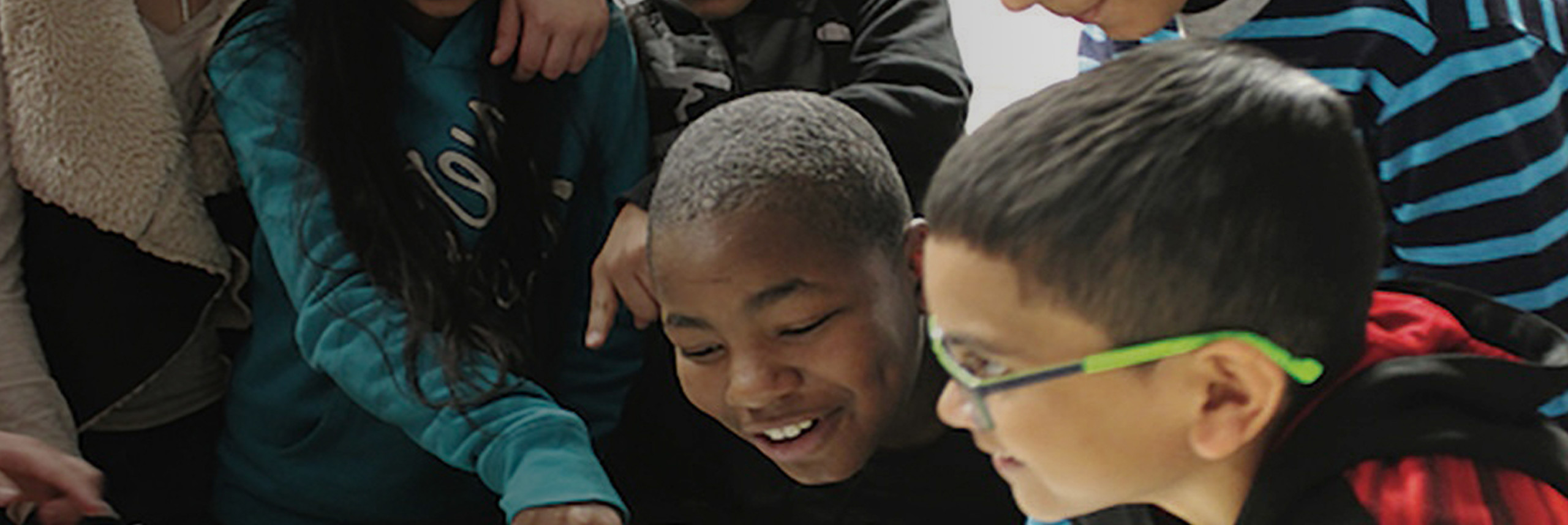 Students smiling in classroom setting