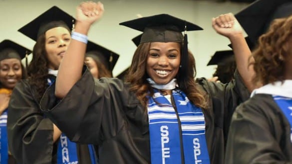 Graduates cheering during ceremonies at Spelman College
