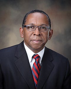 Headshot of C. Reynold Verret