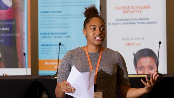 Female walton fellow speaking during conference